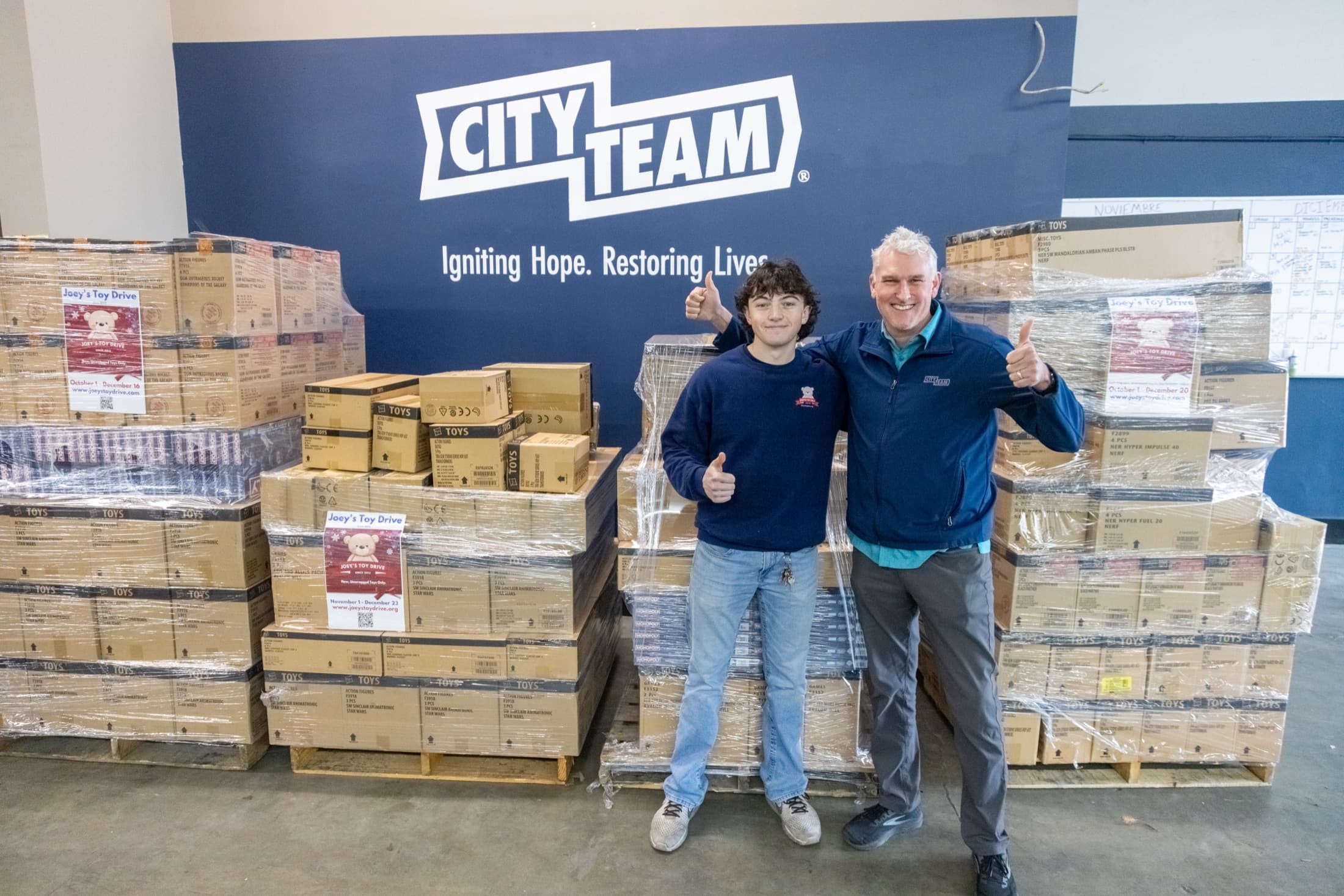 Community partners with pallets of donated toys at CityTeam