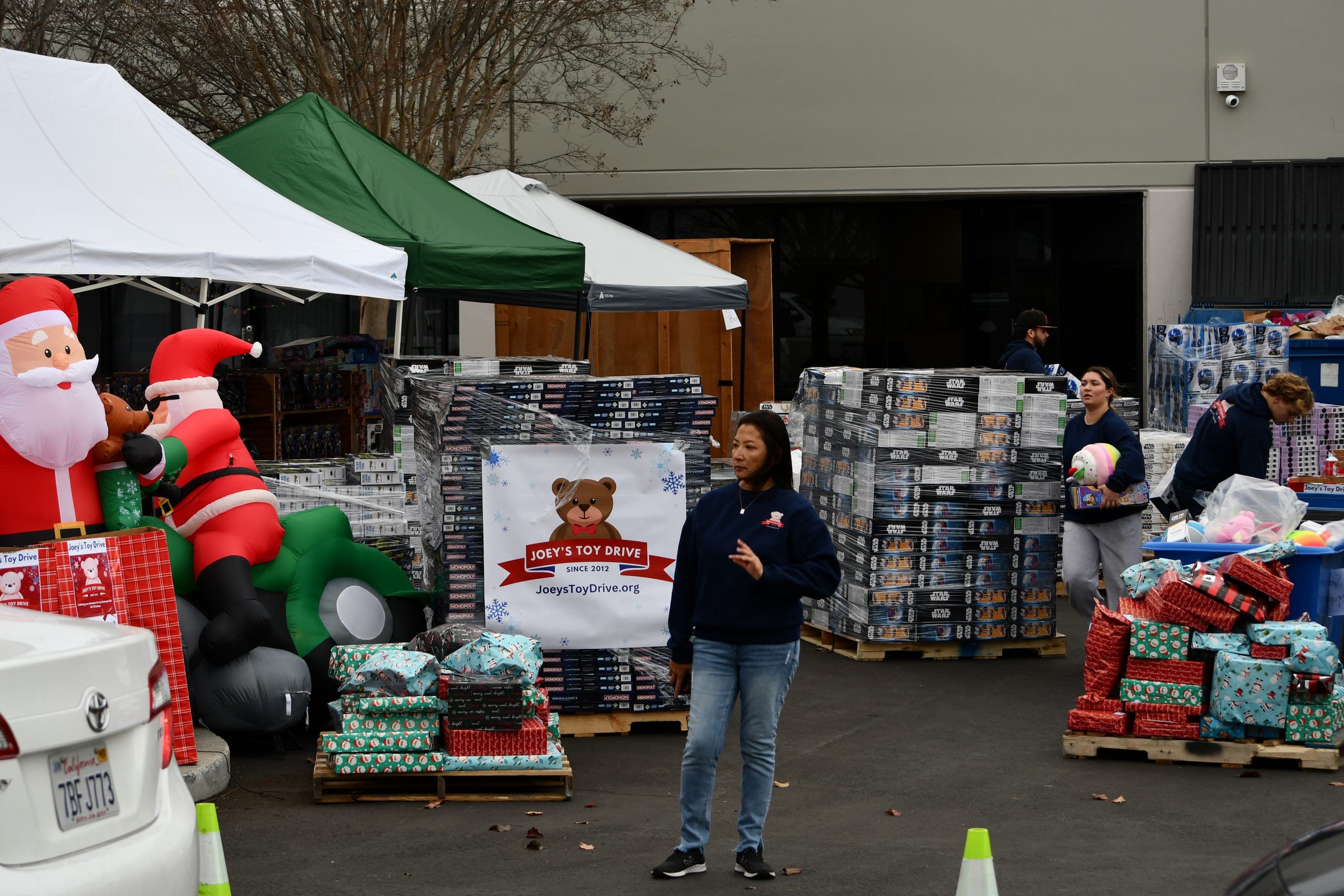 A community toy distribution with gifts ready for local families